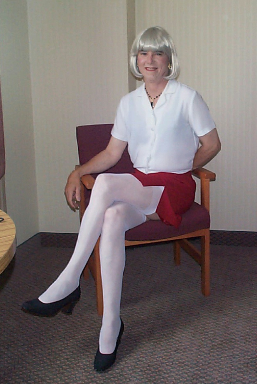 Red skirt, white blouse, sitting